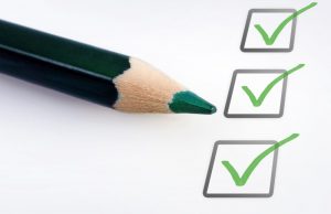 Pencil with 3 green checkmarks in checkboxes