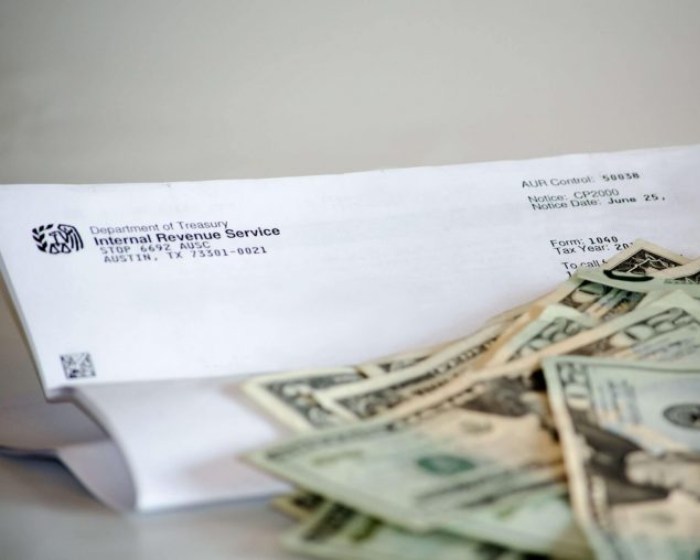 Letter from IRS with money on top