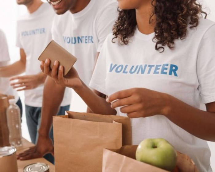 Young people with volunteer shirts on